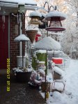 Snow on bird feeders.