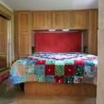 Comforter on bed from hall