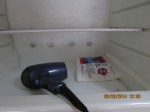 Hair dryer to dislodge packet