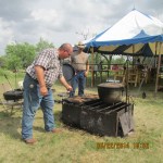 Over an open fire meal preparation