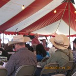 Cowboys listening to preacher