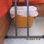 Waste basket under table