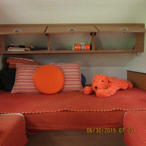 Above the bed cabinets