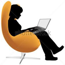 Sitting in chair with laptop computer