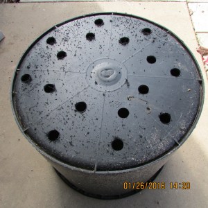 Hole in large black planter