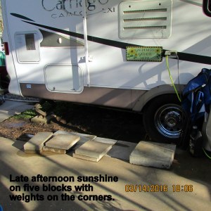 Late afternoon sunshine on blocks with weights