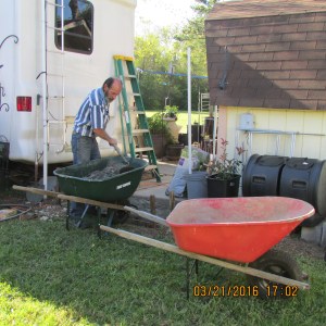 One wheelbarrow to haul bags; one wheelbarrow to mix concrete