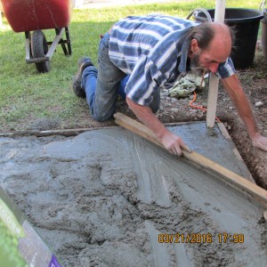 David smoothing the concrete