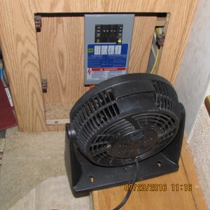 Fan blowing on panel