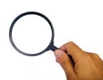 Magnifying glass with human hand