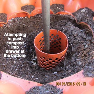 Pushing compost out the bottom