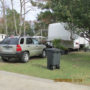 Trash can near my car and trailer