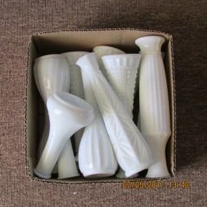 Eleven white vases